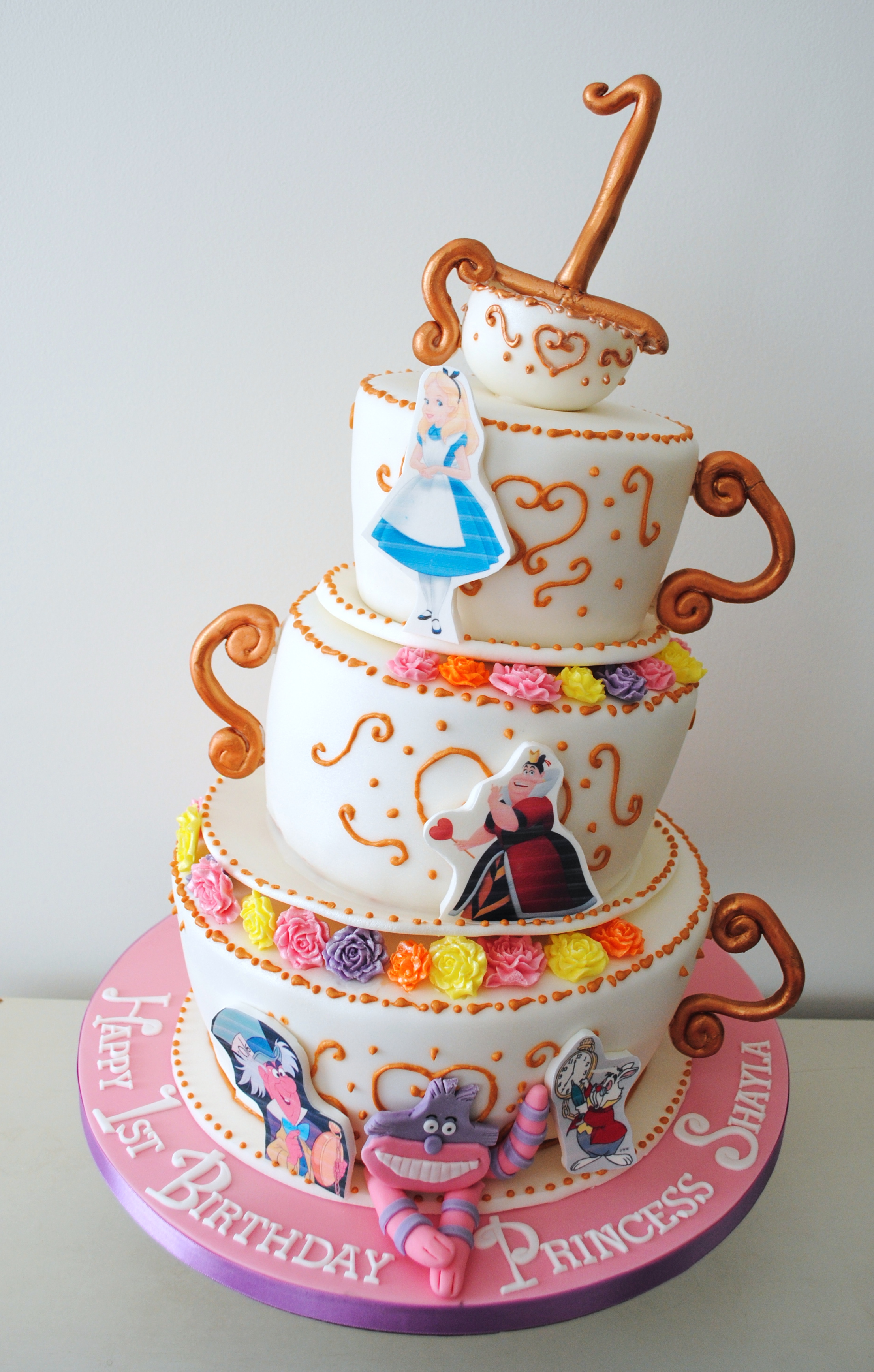 3 tiered Alice in wonderland themed teacup cake