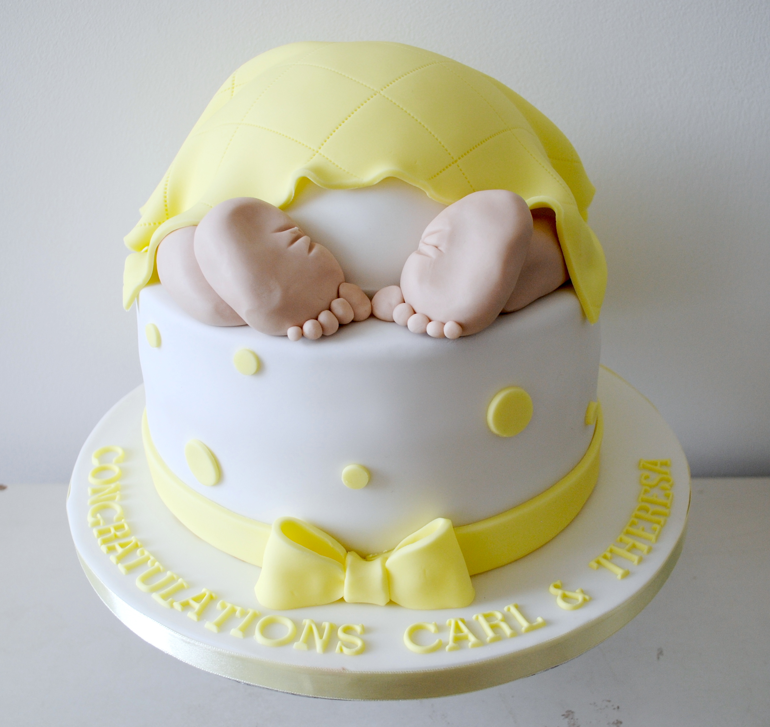 Yellow baby bum baby shower cake