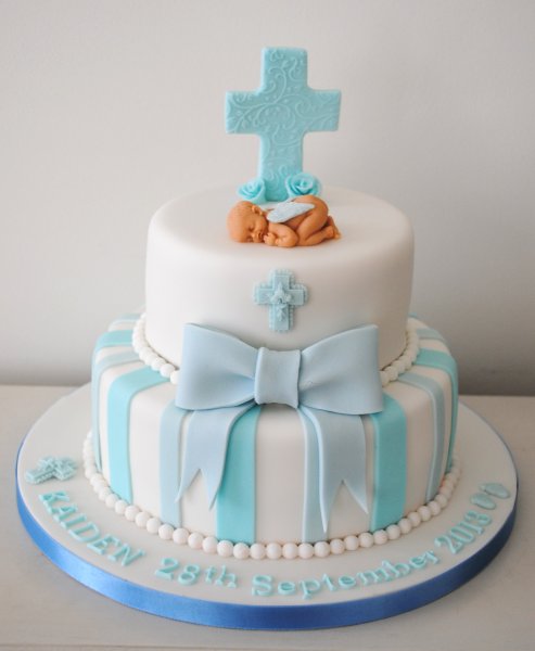 2 tier boy christening cross and bow cake