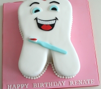 Comical tooth birthday novelty cake