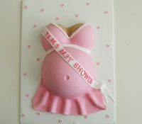 Pink girl baby shower baby bump cake
