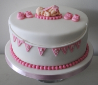 Its a girl baby shower cake with bunting