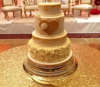 4 tiered gold heart rose swirl cake
