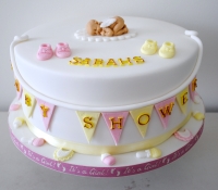 Pink and yellow baby shower cake