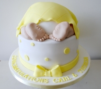 Yellow baby bum baby shower cake