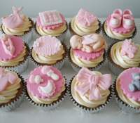 Pink girl baby shower cupcakes