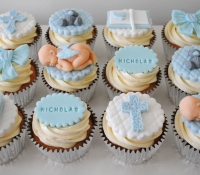 Boy christening cupcakes