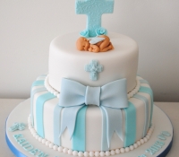 2 tier boy christening cross and bow cake