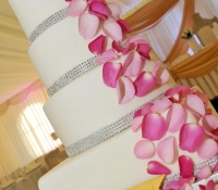 Pink petal and bling 4 tiered wedding cake